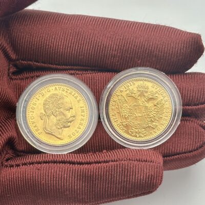 Austrian dukat 1915 featuring an imperial portrait and coat of arms.
